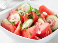 cucumber and tomato salad in a bowl