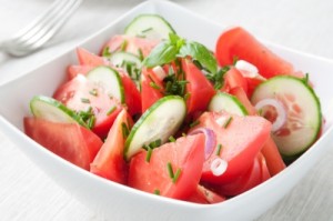 cucumber and tomato salad in a bowl