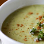 bowl of pale green garlic soup in closeup